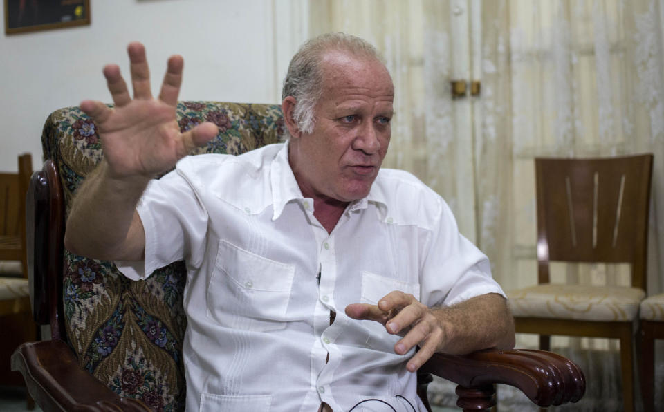 In this Dec. 4, 2018 photo, Vice Minister of Culture Fernando Rojas gives an interview in Havana, Cuba. Rojas says that Cuba is softening the impact of a heavily criticized new law that would have given government inspectors power to shut down any exhibition or performance deemed to violate the country's socialist revolutionary values. (AP Photo/Desmond Boylan)