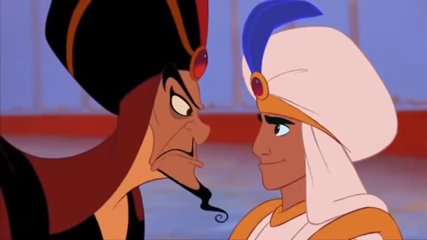 Jafaar glaring at a smiling Aladdin in "Aladdin" (1992)