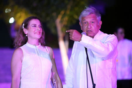 Leftist front-runner Andres Manuel Lopez Obrador of the National Regeneration Movement (MORENA), accompanied by his wife Beatriz Gutierrez Muller, delivers a message after arriving at the third and final debate in Merida, Mexico June 12, 2018. REUTERS/Lorenzo Hernandez