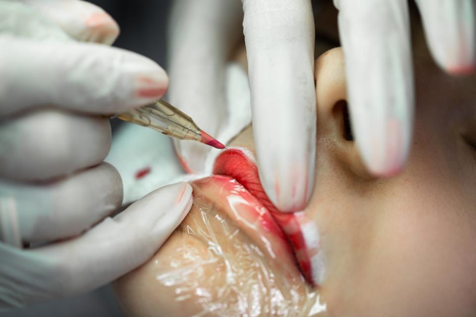 woman getting lip blushing treatment