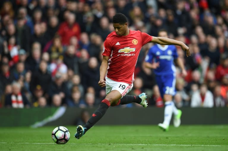 Manchester United's striker Marcus Rashford shoots but misses the target during the English Premier League football match between Manchester United and Chelsea at Old Trafford in Manchester, north west England, on April 16, 2017