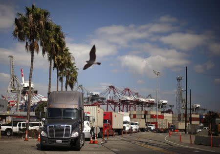 Trucks line up at the Port of Long Beach, in Long Beach, California October 15, 2014. REUTERS/Lucy Nicholson