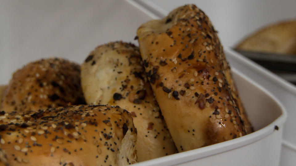 Fresh bagels are baked and sent overnight from New York to the store.