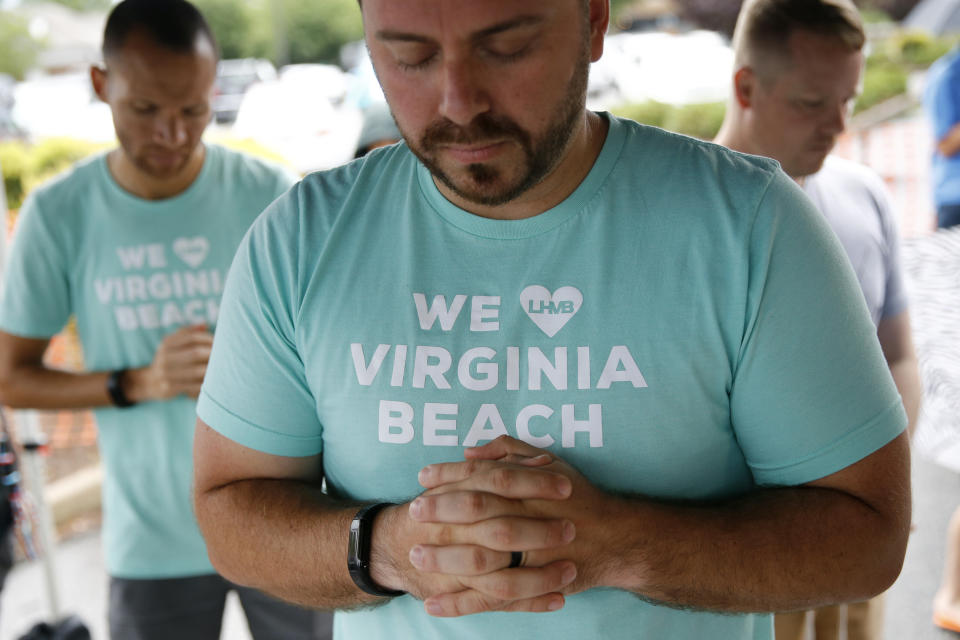 People gather to pray during a vigil in response to a fatal shooting at a municipal building in Virginia Beach, Va., Saturday, June 1, 2019. (Photo: Patrick Semansky/AP)