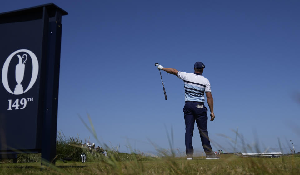 United States' Bryson DeChambeau gestures as his ball goes left from the tee after his drive from the 9th during the third round of the British Open Golf Championship at Royal St George's golf course Sandwich, England, Saturday, July 17, 2021. (AP Photo/Alastair Grant)