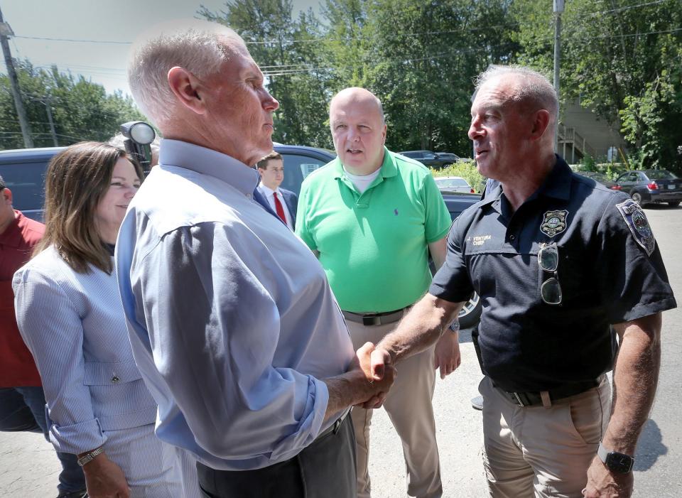 Former Vice President Mike Pence meets Brentwood Police Chief John Ventura at Goody Cole's Smokehouse in Brentwood, N.H., on July 20, 2023.