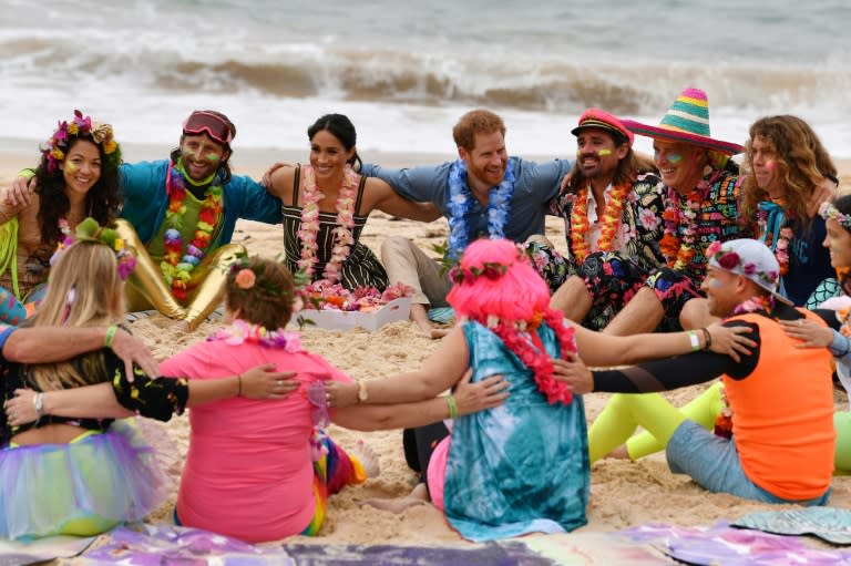 Harry and Meghan join a 'Fluro Friday' session run by OneWave, a local surfing community group that raises awareness about mental health and wellbeing at Sydney's Bondi Beach