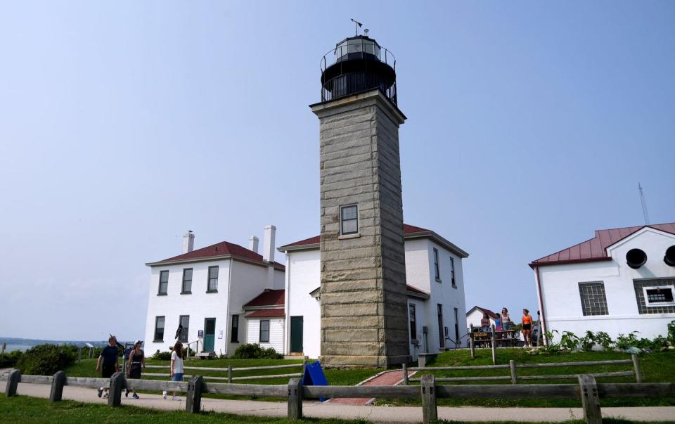 Visitors tour the Beavertail Lighthouse and Museum in Jamestown, which will soon pass from federal to state ownership.