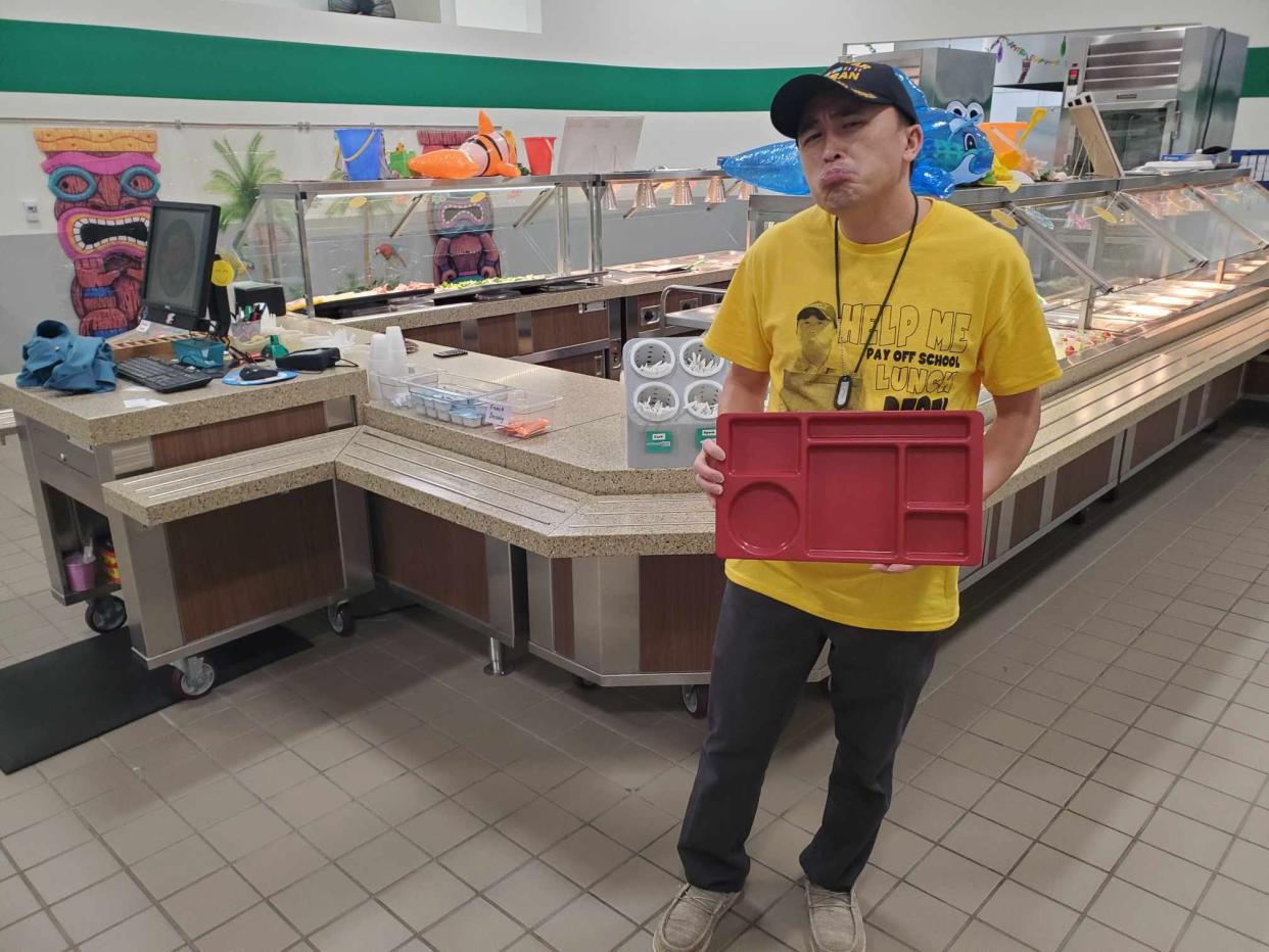 Yauo Yang of Wausau poses for a photo in a Wausau School District cafeteria. Yang is trying to raise $20,000 through a GoFundMe online fundraiser to pay off school lunch debts in the Wausau and D.C. Everest Area school districts.