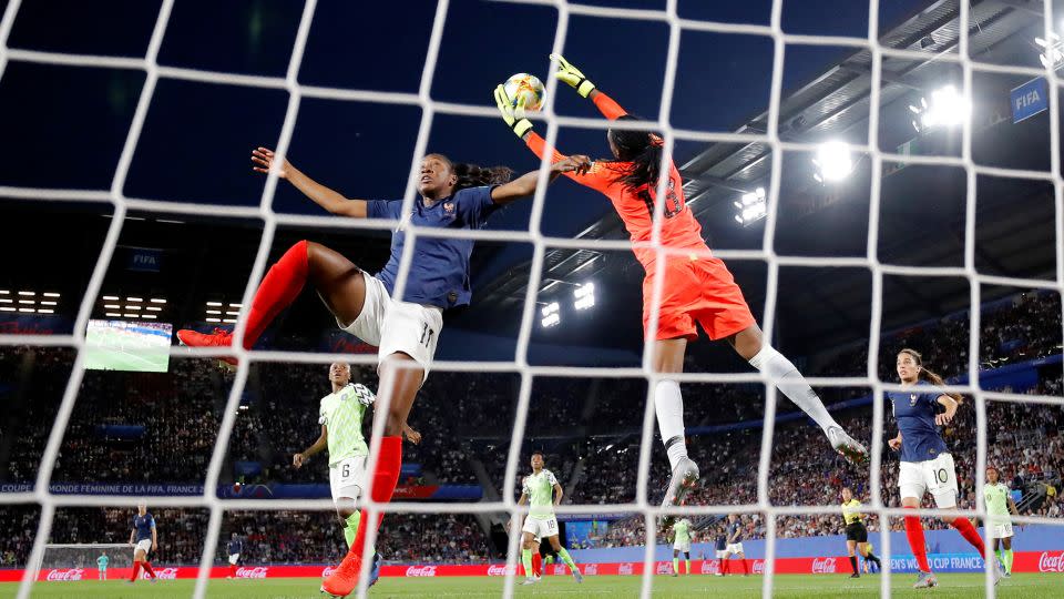 Nnadozie catches a cross while being challenged by France's Kadidiatou Diani at the 2019 Women's World Cup. - Stephane Mahe/Reuters
