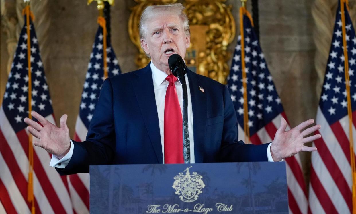 <span>Donald Trump speaks to reporters at Mar-a-Lago on Thursday.</span><span>Photograph: Alex Brandon/AP</span>