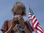 Antonio Basbo breaks down beside the cross with the name of his common-law wife Margie Reckard who died in the shooting at a makeshift memorial after the shooting that left 22 people dead at the Cielo Vista Mall WalMart in El Paso, Texas, on August 5, 2019