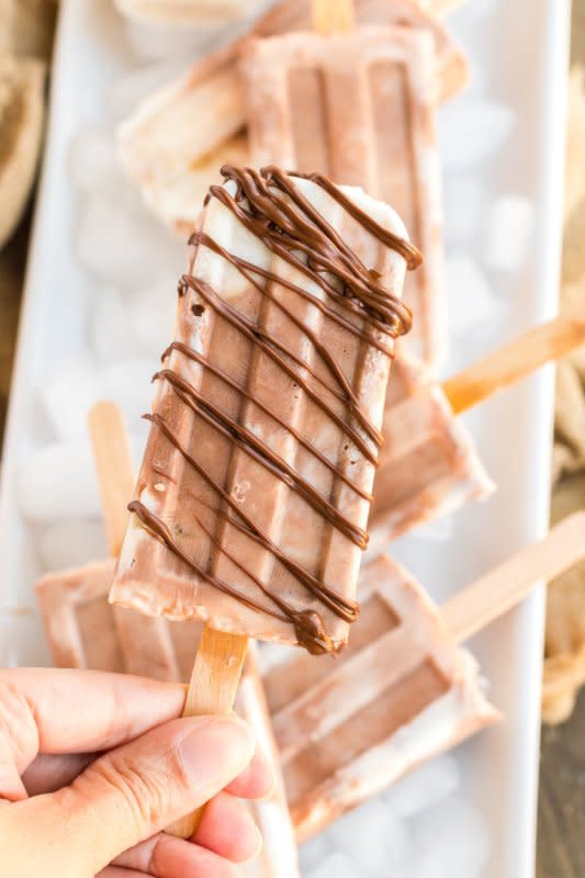 <p>Cupcakes & Kale Chips</p><p>Swirl together the flavors of banana and vanilla with chocolate and hazelnut into a deliciously simple treat that nobody can resist.</p><p><strong>Get the recipe: <a href="https://cupcakesandkalechips.com/banilla-nutella-frozen-yogurt-pops-august-improvchallenge/" rel="nofollow noopener" target="_blank" data-ylk="slk:Banana Nutella Frozen Yogurt Popsicles;elm:context_link;itc:0;sec:content-canvas" class="link ">Banana Nutella Frozen Yogurt Popsicles</a></strong></p>