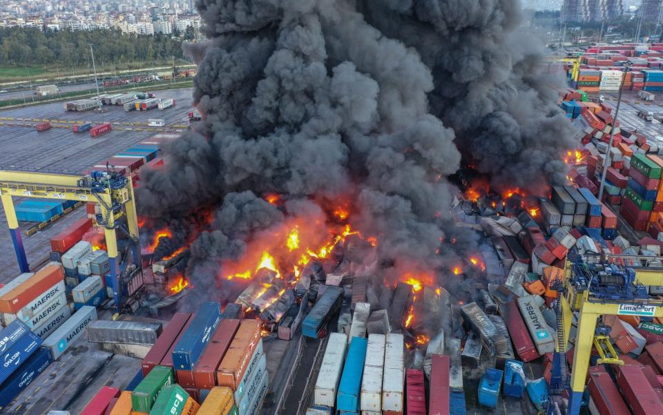 An aerial view of fire in the containers that overturned after the earthquake in the Iskenderun Port in Hatay - Anadolu Agency via Getty Images