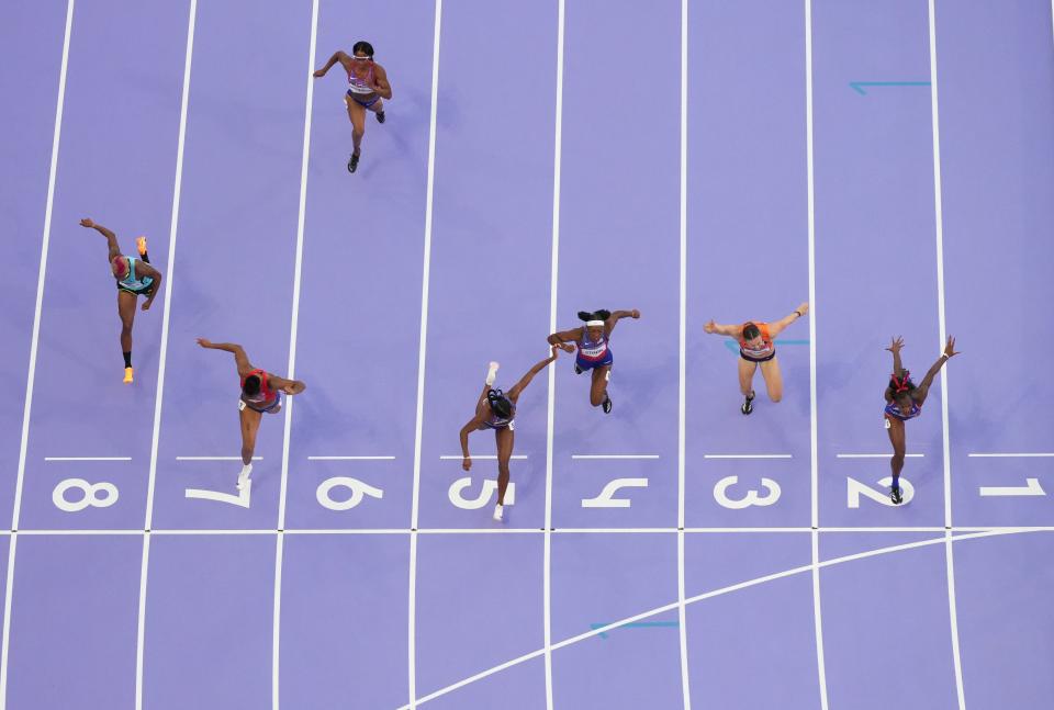 7 photos of Masai Russell's photo finish to win Olympic women's 100m