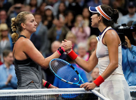 Tennis - US Open - New York, U.S. - September 3, 2017 - Petra Kvitova of the Czech Republic (L) shakes hands with Garbine Muguruza of Spain after she defeated her during their fourth round match. REUTERS/Ray Stubblebine