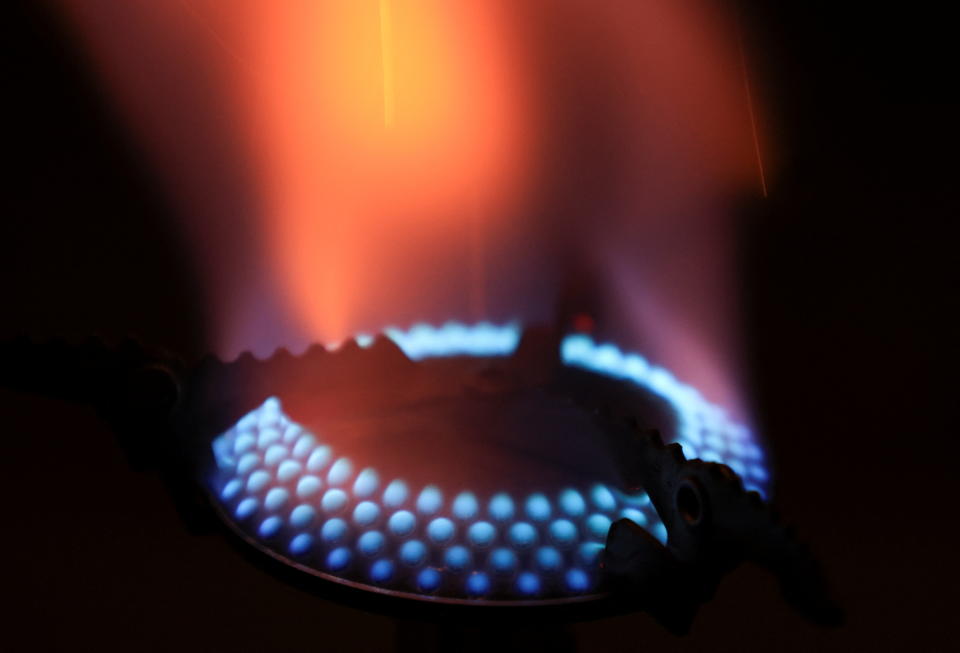 Energy  Gas flames of a mobile cooker are pictured in a private home, as Russia's invasion of Ukraine continues, in Bad Honnef near Bonn, Germany, March 30, 2022. REUTERS/Wolfgang Rattay