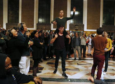 Members of the L.A. Dance Project perform the opera "Invisible Cities" at the Amtrak's Union Station in Los Angeles November 15, 2013. REUTERS/Fred Prouser