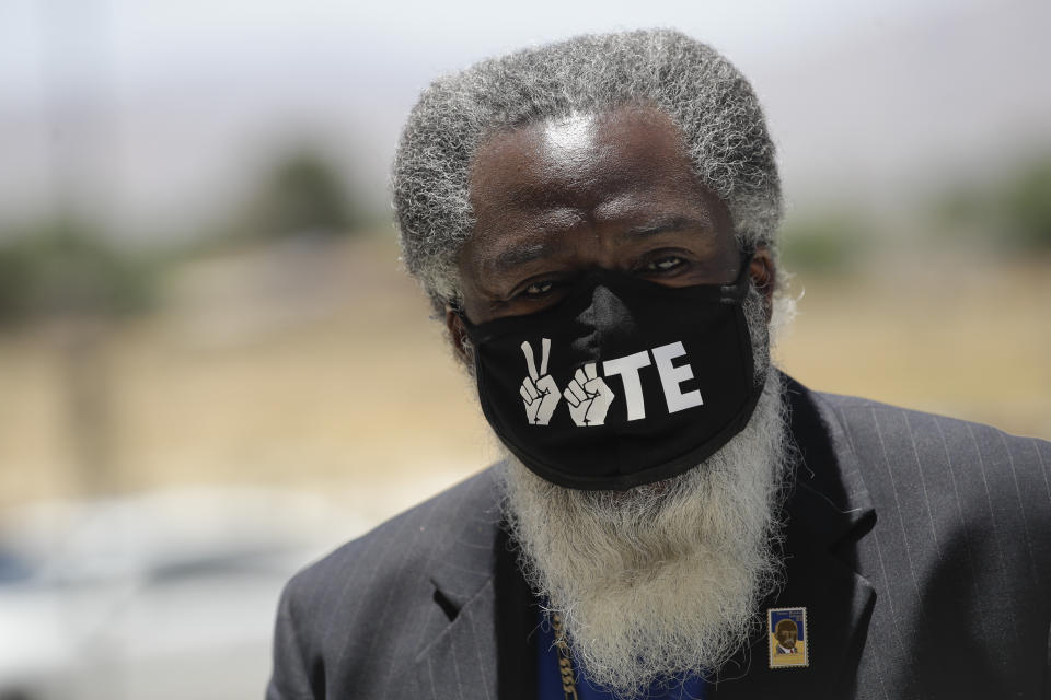 A pastor arrives during a funeral for Robert Fuller Tuesday, June 30, 2020, in Littlerock, Calif. Fuller, a 24-year-old Black man was found hanging from a tree in a park in a Southern California high desert city. Authorities initially said the death of Fuller appeared to be a suicide but protests led to further investigation, which continues. (AP Photo/Marcio Jose Sanchez)