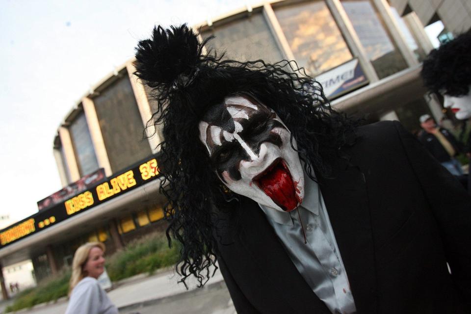 Brian Payne, 42, of Columbus, pays homage to Gene Simmons outside of the Kiss concert at Cobo Arena in Detroit, on Friday. Sept. 25, 2009.