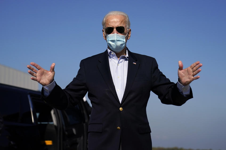 Democratic candidate former Vice President Joe Biden speaks to reporters before boarding his campaign plane at New Castle Airport in New Castle, Del., Thursday, Oct. 22, 2020, en route to Nashville, Tenn., for the final presidential debate against Republican candidate President Donald Trump. (AP Photo/Carolyn Kaster)