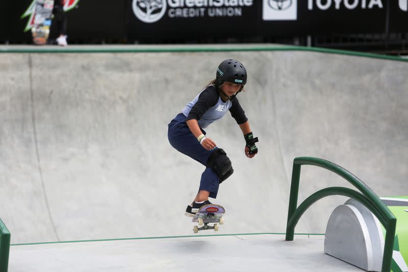 Skateboarders practice during a stop on the Dew Tour