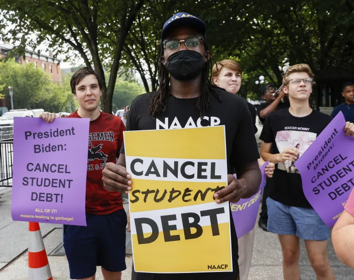 WASHINGTON, DC - JULY 27:  Student loan debt holders take part in a demonstration outside of the white house staff entrance to demand that President Biden cancel student loan debt in August on July 27, 2022 at the Executive Offices in Washington, DC. (Photo by Jemal Countess/Getty Images for We, The 45 Million)