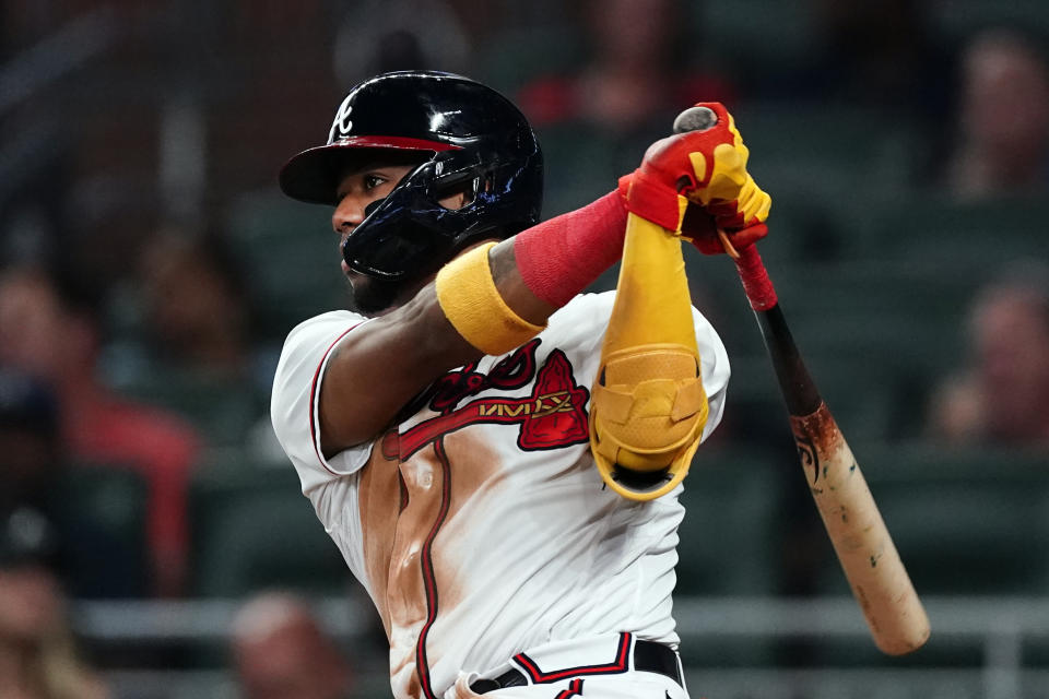 Atlanta Braves right fielder Ronald Acuna Jr. (13) hits a double in the fifth inning of a baseball game against the Washington Nationals, Monday, Sept. 19, 2022, in Atlanta. (AP Photo/John Bazemore)