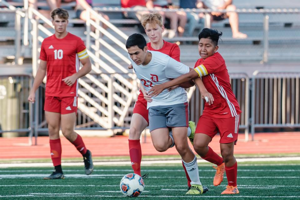 New Philadelphia High School soccer player Julio Sica-Perez in a soccer match Aug. 27 at Quaker Stadium.