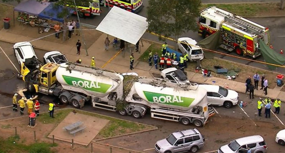 Paramedics and firefighters attend the scene of a crash in Menangle.