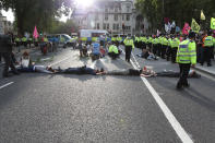 Extinction Rebellion demonstrators in Parliament Square, London. The environmental campaign group has planned for marches to be held at several landmarks in the capital, before moving to Parliament Square in Westminster. (Photo by Luciana Guerra/PA Images via Getty Images)