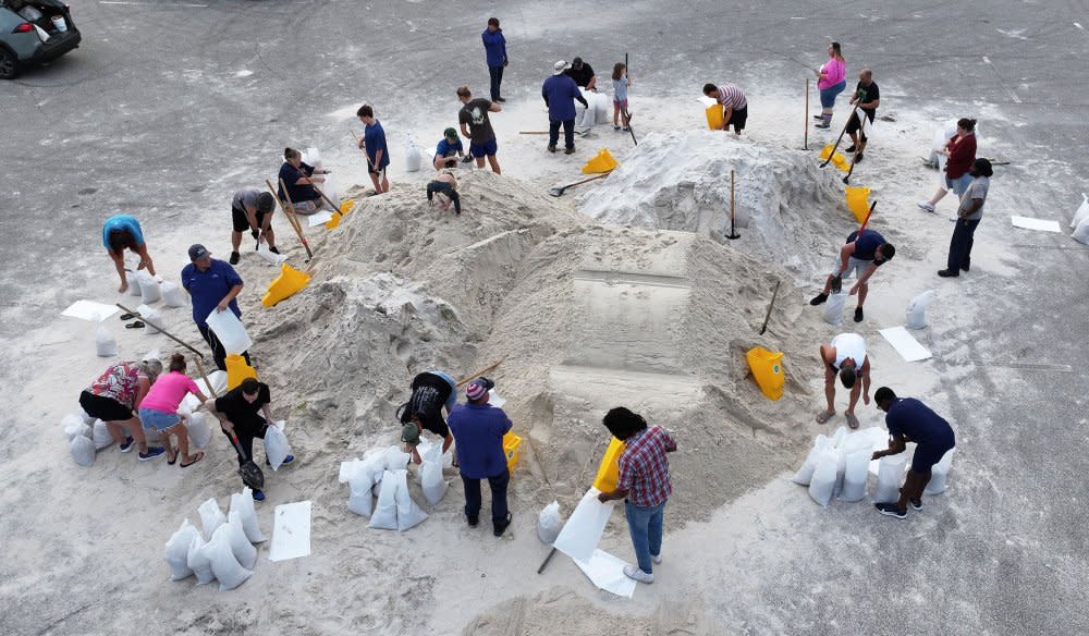 People fill sandbags at Helen Howarth Park ahead of the arrival of Hurricane Helene in Pinellas Park, Fla. on Sept. 25.<span class="copyright">Joe Raedle—Getty Images</span>