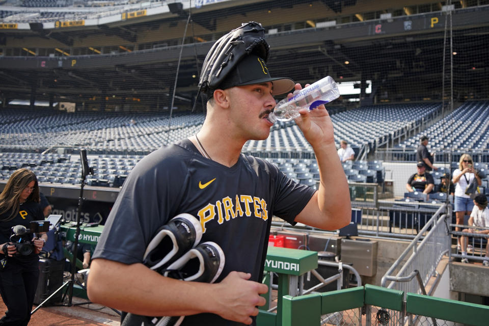 Pittsburgh Pirates first round draft pick, pitcher Paul Skenes takes a drink as he walks to the bullpen at PNC Park following a meeting with reporters after signing with the team in Pittsburgh, Tuesday, July 18, 2023. The Pirates drafted Skenes first player overall in this year's Major League Baseball draft. (AP Photo/Gene J. Puskar)
