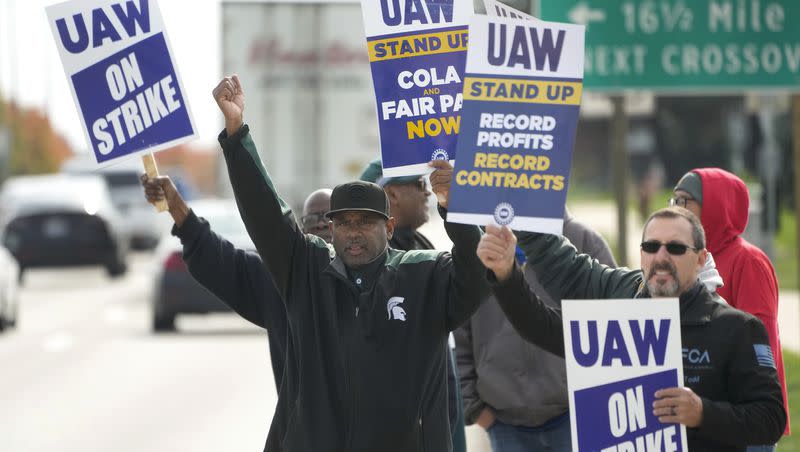 United Auto Workers members walk the picket line during a strike at the Stellantis Sterling Heights Assembly Plant, in Sterling Heights, Mich., Monday, Oct. 23, 2023. A tentative agreement was reached on Wednesday pending approval by union members.