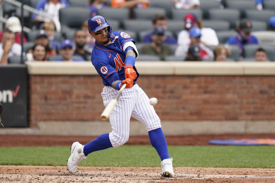 New York Mets' Javier Baez hits a two-run home run scoring Michael Conforto during the fourth inning of a baseball game against the Washington Nationals, Sunday, Aug. 29, 2021, in New York. (AP Photo/Corey Sipkin)