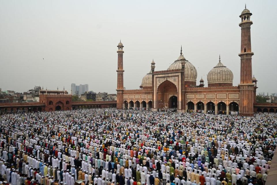 Muslims offer a special morning prayer to start the Eid al-Fitr festival, which marks the end of their holy fasting month of Ramadan, at the Jama Masjid mosque in the old quarter of Delhi on May 3, 2022.<span class="copyright">MONEY SHARMA/AFP via Getty Images</span>