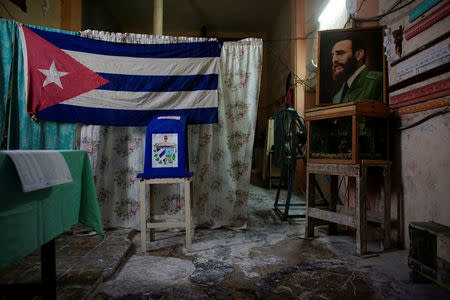 A view of a polling station decorated with an image of late Cuban President Fidel Castro moments before its opening to the public in Havana, Cuba November 26, 2017. REUTERS/Alexandre Meneghini