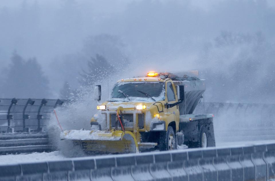 A snow plow clears the road of snow along the New York State Thruway Interstate 87 in Tarrytown