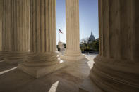 FILE - The Supreme Court is seen in Washington, with the U.S. Capitol in the distance, Nov. 4, 2020. The end of Roe v. Wade started in the Senate. The Senate Republican partnership with President Donald Trump to confirm conservative justices paved the way for the Supreme Court’s landmark ruling on abortion rights. (AP Photo/J. Scott Applewhite, File)