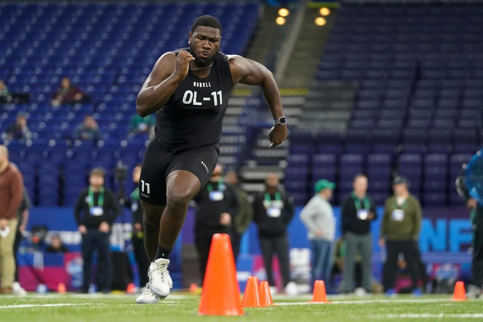 Tennessee Chattanooga offensive lineman McClendon Curtis runs a drill at the NFL football scouting combine in Indianapolis, Sunday, March 5, 2023. (AP Photo/Darron Cummings)