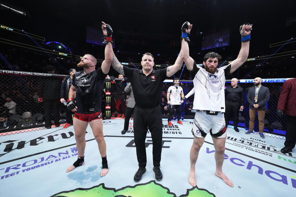 LAS VEGAS, NEVADA - DECEMBER 10: (L-R) Jan Blachowicz of Poland and Magomed Ankalaev of Russia react after their UFC light heavyweight championship fight results in a split draw during the UFC 282 event at T-Mobile Arena on December 10, 2022 in Las Vegas, Nevada. (Photo by Chris Unger/Zuffa LLC)