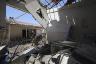 FILE - In this June 13, 2021, file photo, a man walks through a heavily damaged hospital in the city of Afrin, Syria. Countries like Lebanon, Syria, Iraq, Lebanon and Yemen are all teetering on the brink of humanitarian catastrophe with an economic implosion that threatens to throw the region into even deeper turmoil. (AP Photo/Ghaith Alsayed)