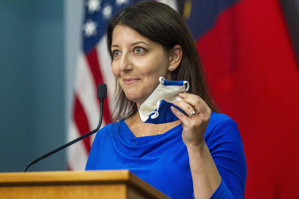 North Carolina Department Health and Human Services Dr. Mandy Cohen encourages North Carolinians to wear a face mask in public during a briefing on North Carolina's coronavirus pandemic response held at the North Carolina Emergency Operations Center, Wednesday, Sept. 30, 2020, in Raleigh, N.C. (Travis Long/The News & Observer via AP)