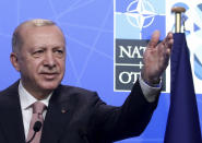 Turkey's President Recep Tayyip Erdogan speaks during a media conference at a NATO summit in Brussels, Monday, June 14, 2021. U.S. President Joe Biden is taking part in his first NATO summit, where the 30-nation alliance hopes to reaffirm its unity and discuss increasingly tense relations with China and Russia, as the organization pulls its troops out after 18 years in Afghanistan. (Yves Herman, Pool via AP)