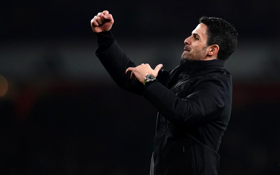 Mikel Arteta celebrates with Arsenal fans after the win at Brentford