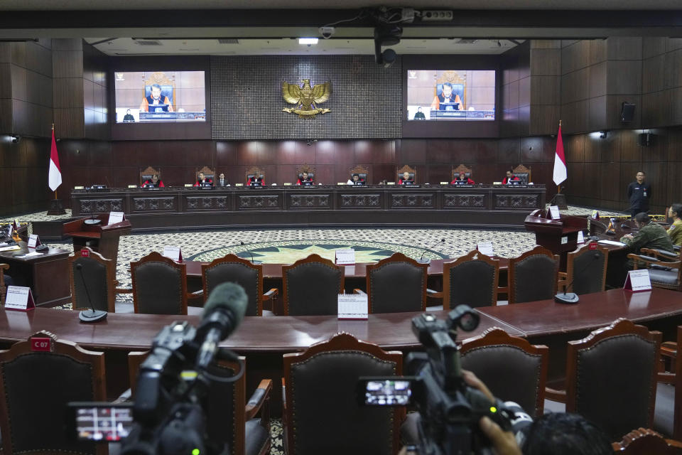 Judges preside over the hearing on a petition seeking for a maximum age limit of presidential and vice presidential candidates to able to run in elections, at the Constitutional Court in Jakarta, Indonesia Monday, Oct. 23, 2023.(AP Photo/Tatan Syuflana)