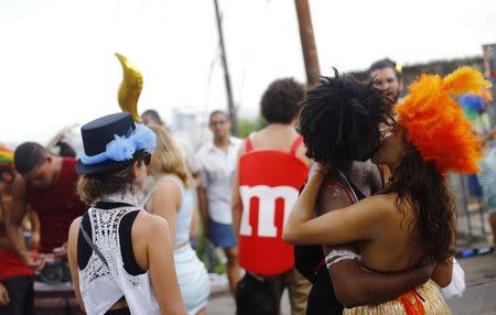 Revellers take part in an annual block party known as "Ceu na Terra" (Heaven in Earth), one of the many carnival parties to take place in the neighbourhoods of Rio de Janeiro, February 14, 2015. REUTERS/Ricardo Moraes