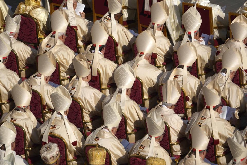 Prelates attend a mass presided over by Pope Francis and concelebrated by the new cardinals for the start of the XVI General Assembly of the Synod of Bishops in St. Peter's Square at The Vatican, Wednesday, Oct.4, 2023. Pope Francis is convening a global gathering of bishops and laypeople to discuss the future of the Catholic Church, including some hot-button issues that have previously been considered off the table for discussion. Key agenda items include women's role in the church, welcoming LGBTQ+ Catholics, and how bishops exercise authority. For the first time, women and laypeople can vote on specific proposals alongside bishops (AP Photo/Andrew Medichini)