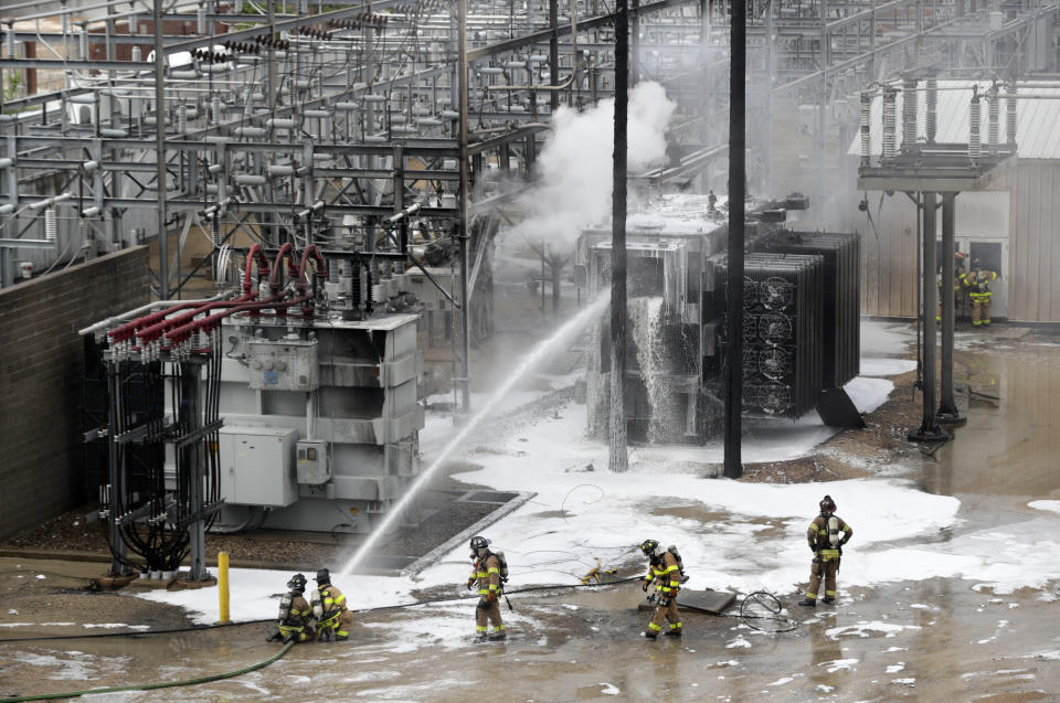 Members of the Madison Fire department respond at the scene of a fire at Madison Gas and Electric, Friday, July 19, 2019 in Madison, Wis. (Steve Apps/Wisconsin State Journal via AP)