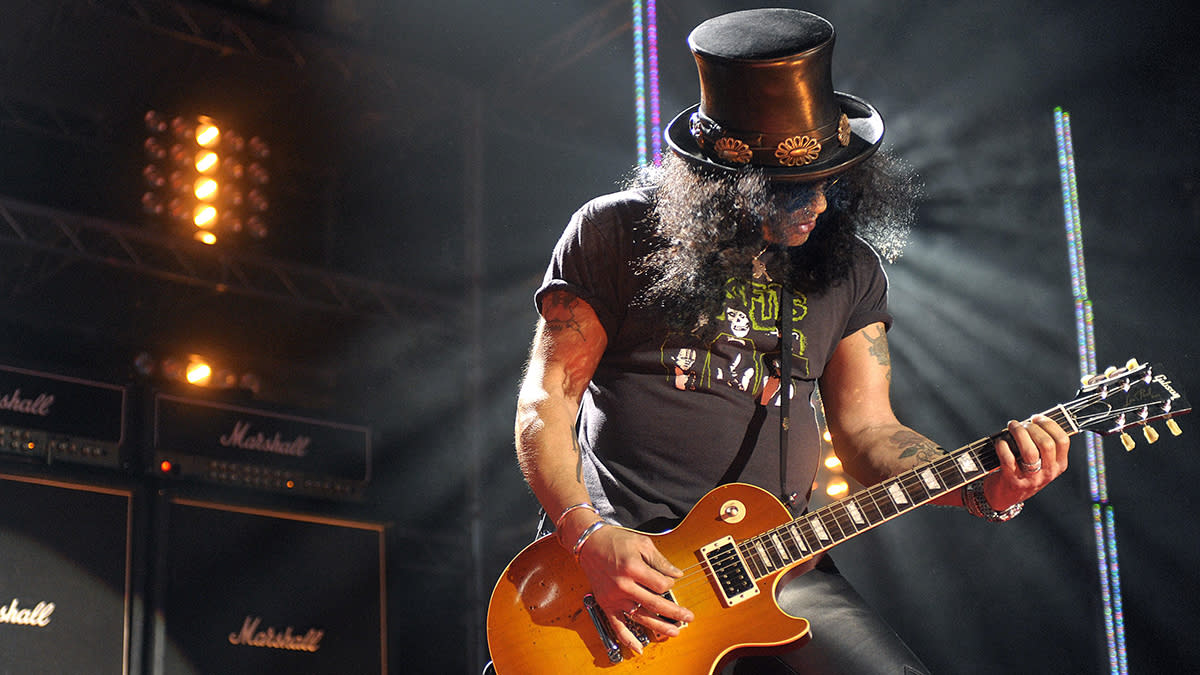  Slash playing in front of his Marshall stack. 